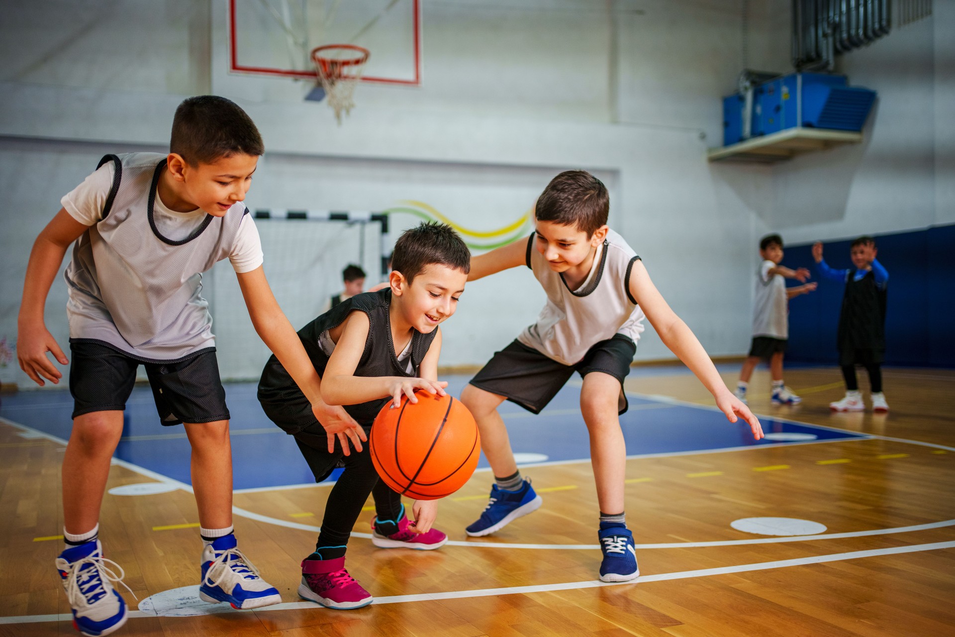 Junior basketball team is practicing game at indoor court